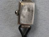 a close up of a watch on a mannequin mannequin