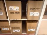 several boxes are stacked on top of each other on a shelf