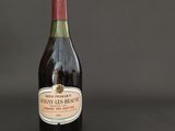 a bottle of wine that is sitting on a table