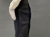 an image of a mannequin wearing a white shirt and black skirt