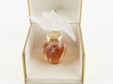 an image of a bottle of perfume sitting inside of a box