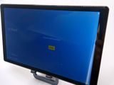 a tablet computer with a blue screen on a stand