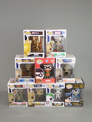 a pile of pop vinyl figures on a table