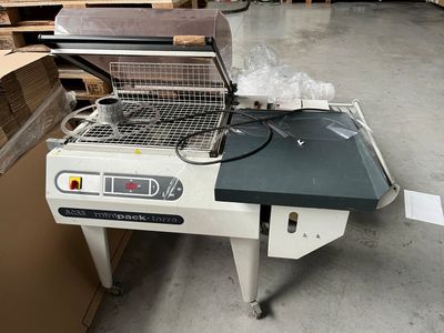 a machine that is sitting on a table in a warehouse