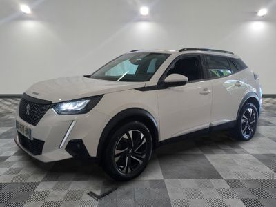 a white suv parked on a checkered floor in a garage