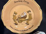 a plate with a picture of a man and a woman on it