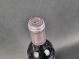 a bottle of wine that is sitting on a table