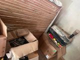 a pile of boxes that are sitting in the corner of a room