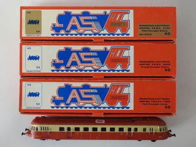 three red and white train cars are stacked on top of each other