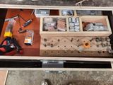 a drawer full of tools on a workbench