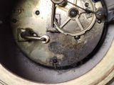 a close up of a clock that is on a table
