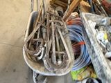 a man that is standing next to a pile of tools