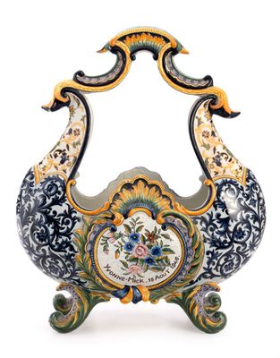 a decorative vase with a peacock design on it