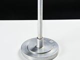 a silver candle that is sitting on a white table