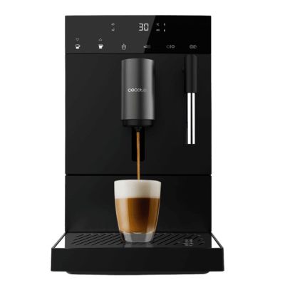 a black coffee machine with a cup of coffee in front of it