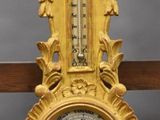 a clock that is hanging on the wall in the room