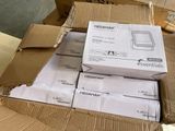 many boxes of electronic equipment sitting on the floor