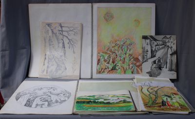 a table with a bunch of drawings and pictures on it
