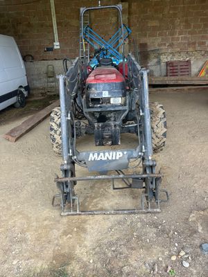 a tractor that is parked in a garage