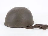 an old helmet with a brown cord on a white background