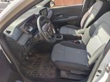 the interior of a car with the driver ' s seat folded down