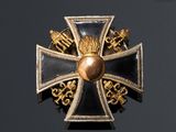 a close up of a cross on a black background