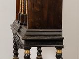 a small wooden table with a clock on top of it