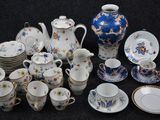 many different types of tea and coffee cups and saucers
