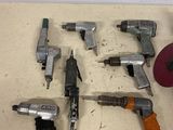 a lot of tools that are laying out on the floor