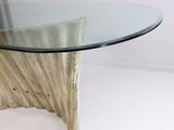 a glass table with a wooden base and a glass top