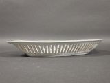a white bowl that is sitting on a table