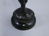 a statue of a woman that is standing on a pedestal