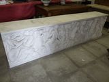 a large stone sculpture on the floor in a room