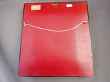 an image of a red folder sitting on top of a table