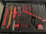 many tools in a tool box on the table