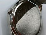 an image of a close up of a watch on a white surface