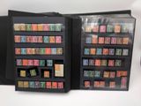 two black folders with stamps on them sitting on a table