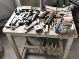 a workbench with many tools on it in a garage