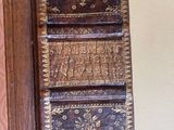 an old book with writing on it sitting on a table