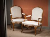 two chairs sitting next to each other in a room