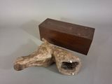 a piece of wood that has been carved into a horse ' s head