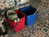 two buckets that are sitting next to each other on the floor
