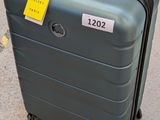 a piece of luggage sitting on the ground with a price tag on it