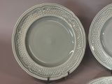 two plates with designs on them are sitting on a table