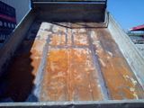 a truck that has rust on the side of it