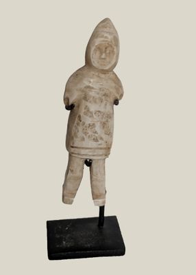 statue of a man with a hood on his head standing on a black base