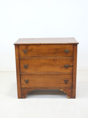 an old wooden chest of drawers with three drawers on each side