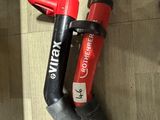 a picture of a red and black blow dryer and a red and black blow dryer