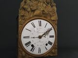 a clock that has roman numerals on the face of it
