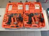 deux outils orange dans un coffret posé sur une table